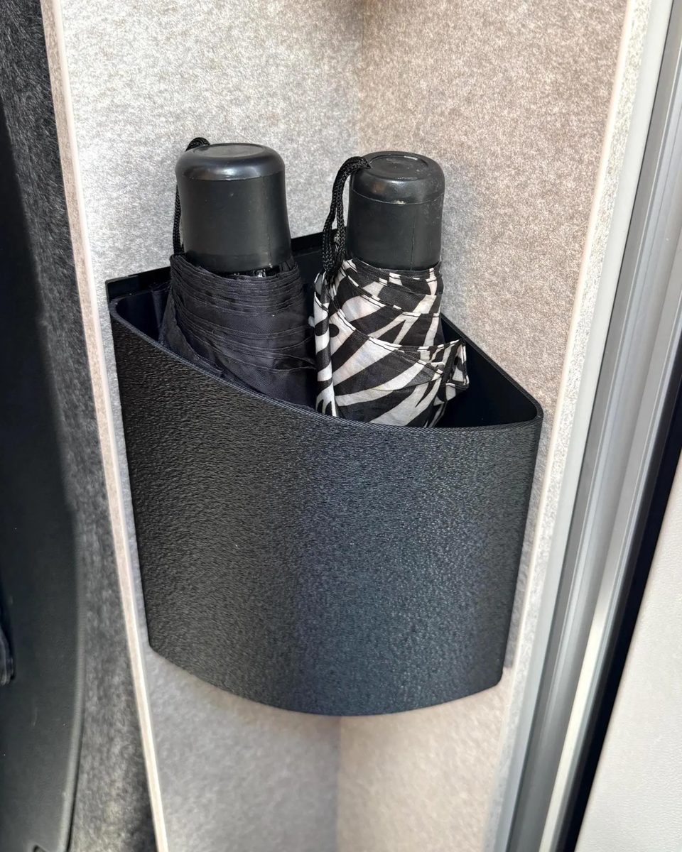 Hymer ML-T corner storage bin with umbrellas