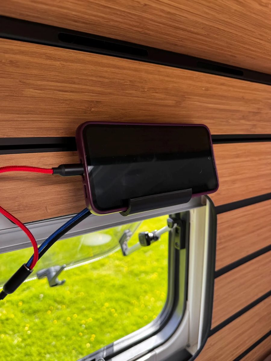 Hymer rail phone holder charging above bed